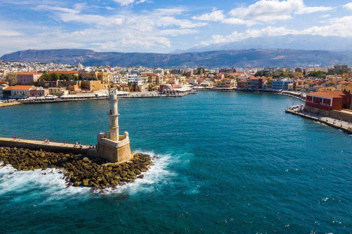 Picturesque old port of Chania. Landmarks of Crete island. Greece. Aerial view of the beautiful city of Chania with it's old harbor and the famous lighthouse, Crete, Greece.