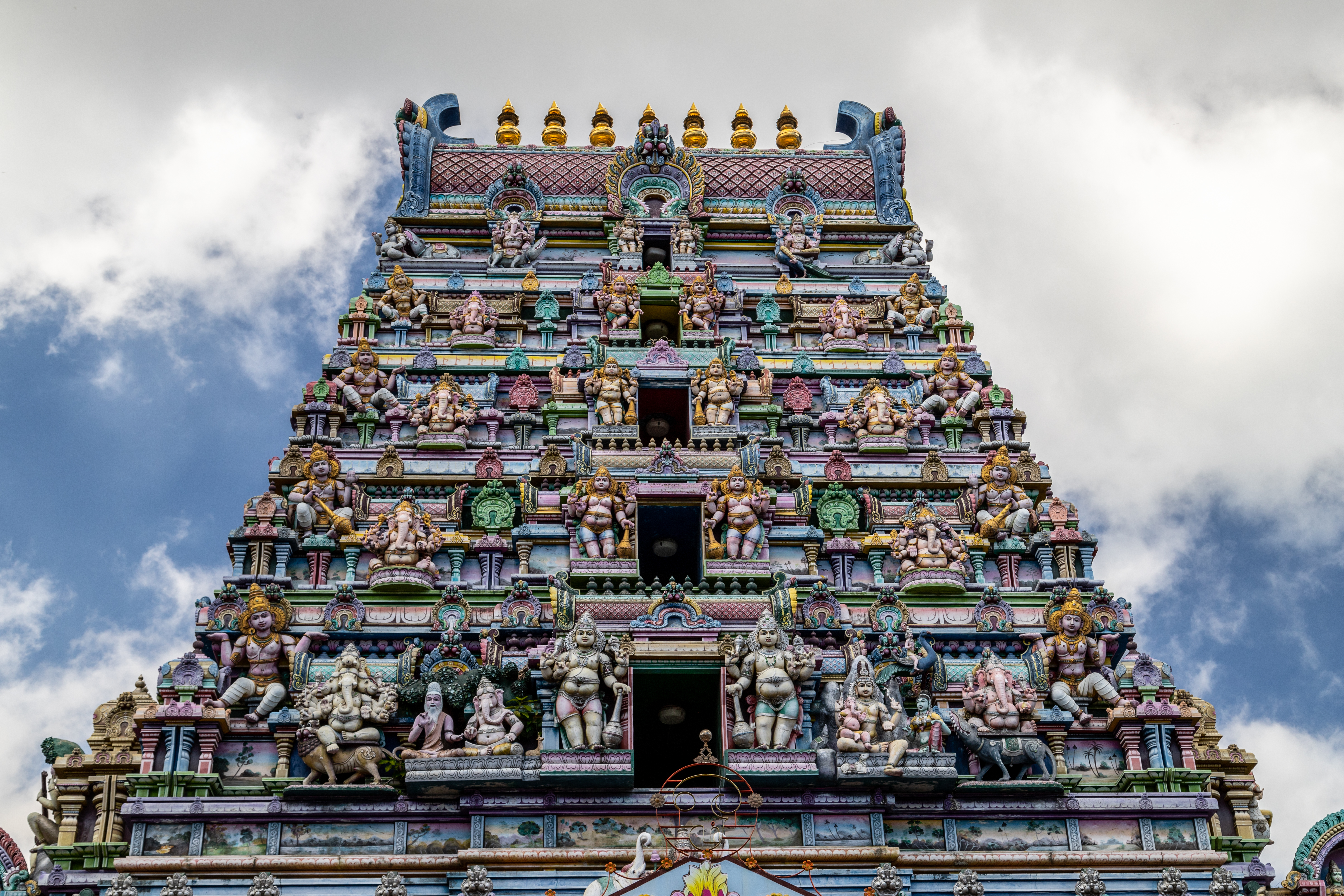 Hindu temple with colorful facade called Arulmihu Navasakti Vinayagar Temple in Victoria on Mahé Island